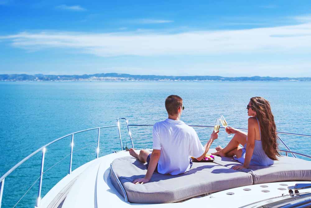 young couple on private boat tour during best shore excursion to amalfi coast