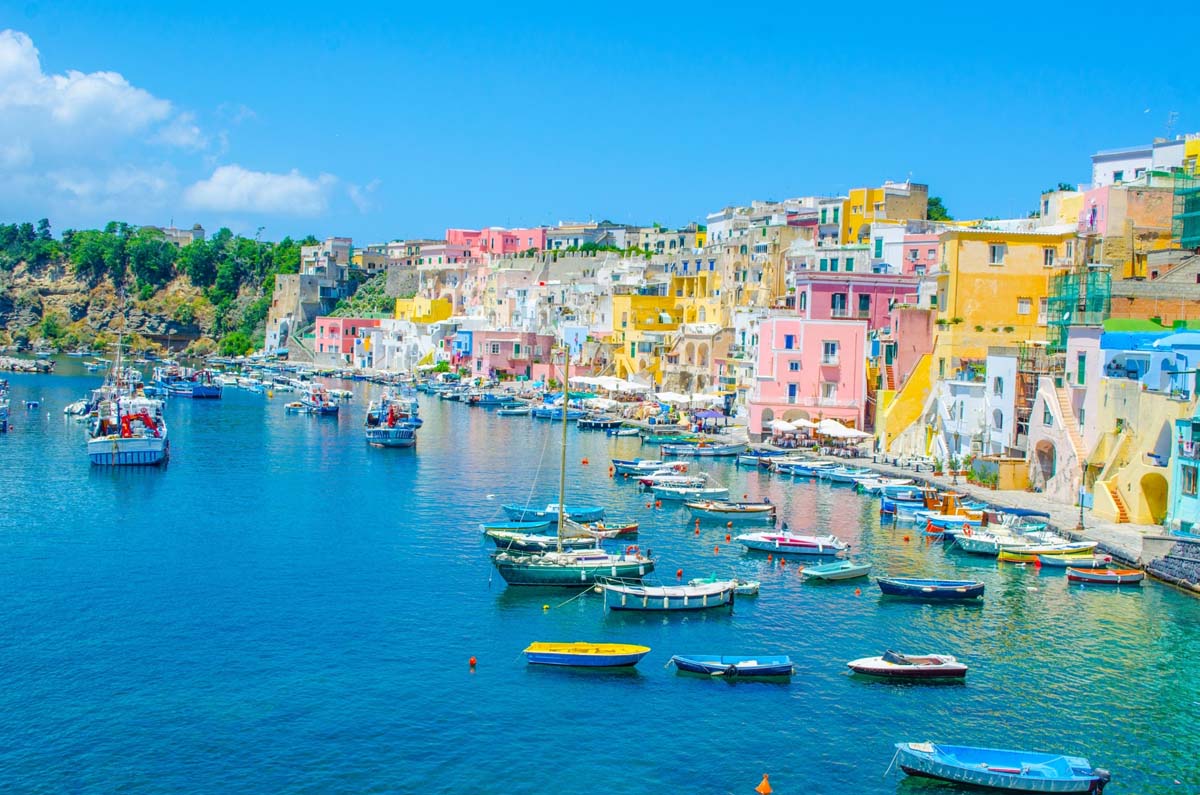 colored homes facing the sea in procida island, italy