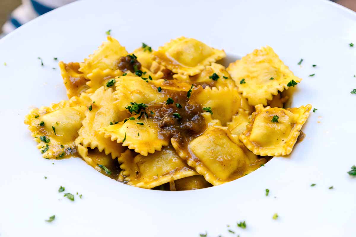 A dish of agnolotti del plin, a stuffed pasta that is one of the most typical food of the Piedmont region in Italy